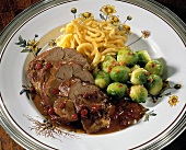 Sweet & sour leg of hare with Brussels sprouts & noodles