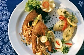 Baked carp with potatoes