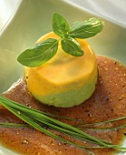 Pepper mousse on tomato sauce with chives