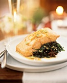 Salmon fillet with ginger on spinach