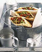 Pita breads filled with bacon and broad beans