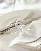 Cutlery decorated with plastic star for Christmas