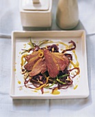 Barbery duck breast on mango and red cabbage salad