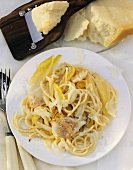 Spaghetti with chicory sauce & red perch fillets on plate