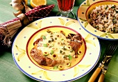 Pork chop with olive and caper sauce on plate