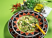 Chicken soup with green asparagus and chili