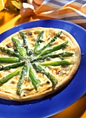 Pizza with green asparagus and cream gorgonzola