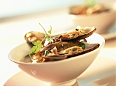 Mussels with spicy sauce in bowl