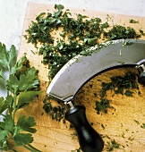 Chopping parsley finely with a mezzaluna