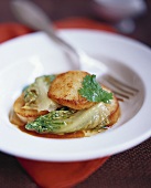 Fried pilgrim scallops on leaf beet