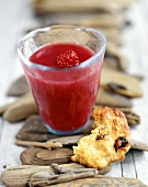 Raspberry drink and a piece of muffin