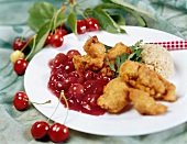 Chicken breast coated with wheatgerm, cherry sauce & rice
