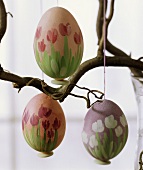 Painted Easter eggs hanging on a branch