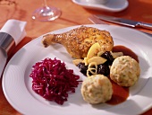 Goose with apple & plum stuffing, bread dumplings & red cabbage