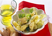 Potato salad with grape seed oil, sprouts and coriander