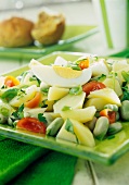 Potato salad with broad beans, tomatoes and egg