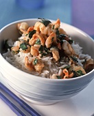 Rice with shrimps, coriander and curry sauce in bowl