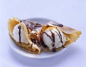 Two crepes with vanilla ice cream & chocolate sauce