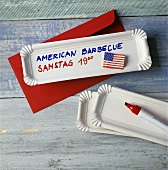 Einladung zum American Barbecue auf einem Pappteller