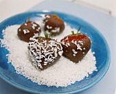 Chocolate strawberries with grated coconut