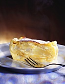 A piece of apple and curd cheese strudel