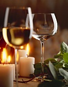 White wine glasses in candlelight