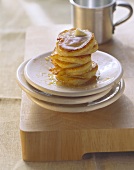 Potato pancakes with maple syrup and piece of butter
