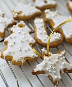 Glazed biscuits with silver balls as tree ornaments