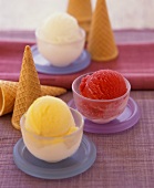 Vanilla, strawberry and lemon ice cream in small bowls