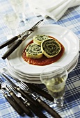 Rolled pasta with spinach & ricotta filling on tomato sauce