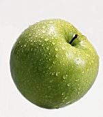 Granny Smith apple with drops of water