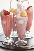 Strawberry milkshakes with scoops of ice cream