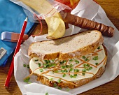 Processed cheese sandwich, with chocolate bar and banana