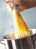 Placing Spaghetti in Boiling Water