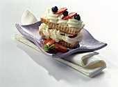 Puff pastry slice with maracuya mousse and berries