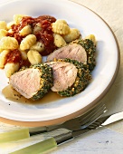 Pork fillet in herb crust with gnocchi and tomato sauce