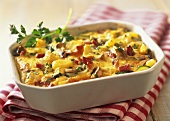 Potato and ham bake with courgettes and mushrooms