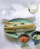 White asparagus with three kinds of sauce & white wine glass