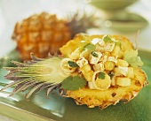 Spicy stuffed baby pineapple with smoked tofu, spring onions