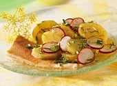 Smoked trout fillets with potato and radish salad