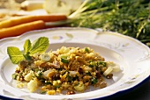 Tasty quinoa salad with fruit, raisins and mint