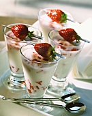 Strawberry milkshake in four glasses