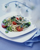 Narrow ribbon pasta (tagliolini) with broccoli & tomatoes