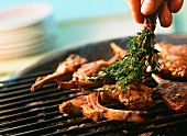 Lamb chops with thyme on the barbecue