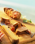 Pork fillet in bacon wrapping, a slice cut