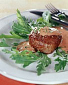 Beef fillet with balsamic sabayon on rocket