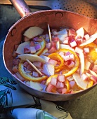 Rhubarb and apple compote with oranges in the pan