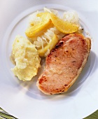 Slice of roast smoked pork loin with mashed potato & sauerkraut