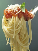 Spaghetti with tomato sauce on a fork