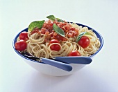 Spaghetti with tomato sauce and tomatoes in a dish